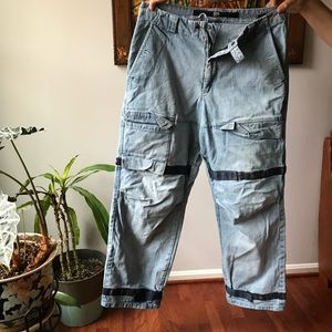 Girbaud Jeans. Light wash with blue straps.